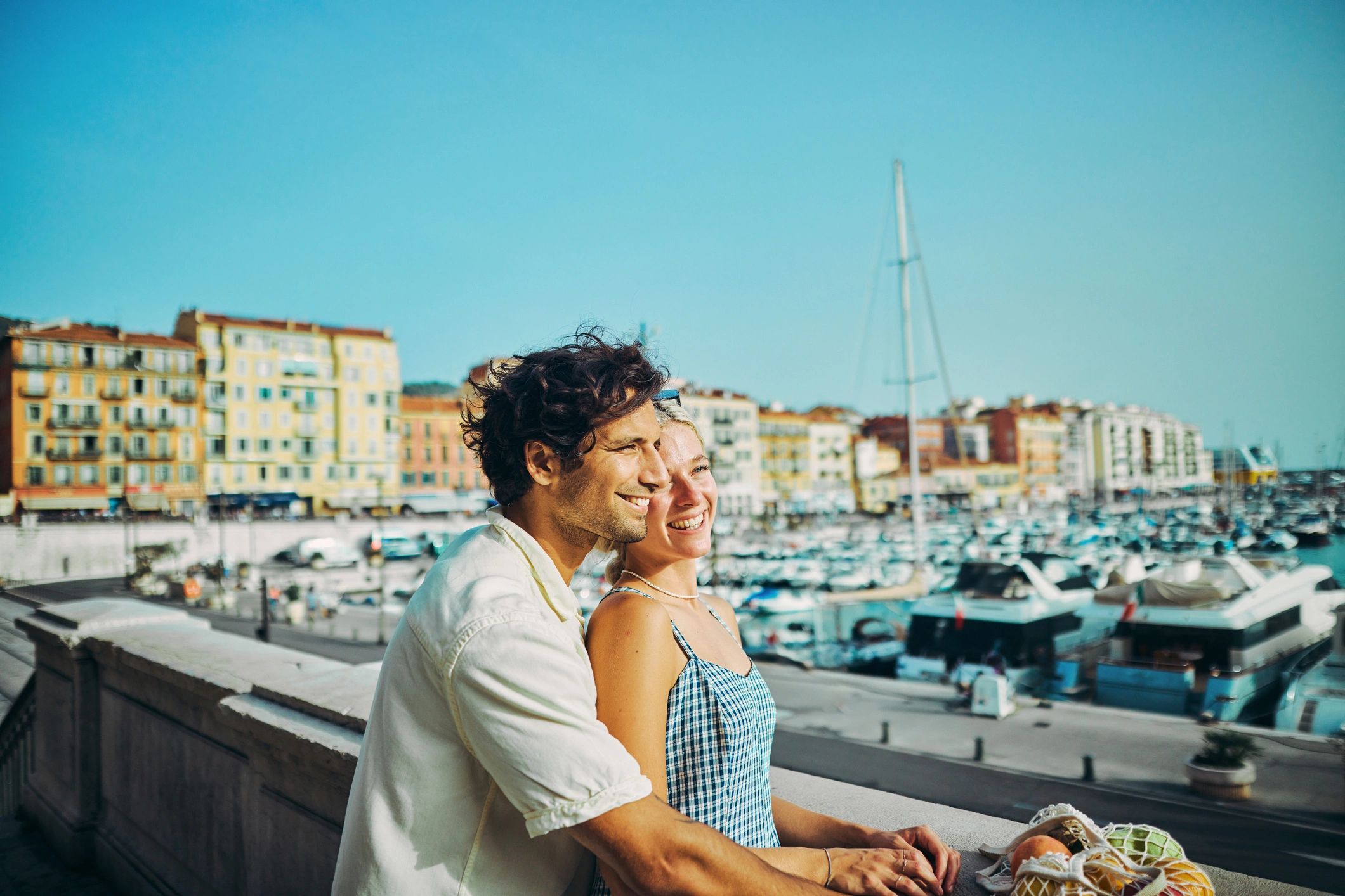 Couple enjoying a scenic honeymoon destination on the coast