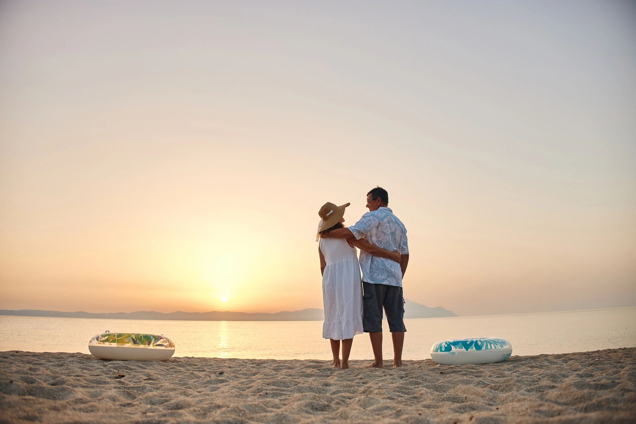 Couple enjoying a sunset beach luxury holiday