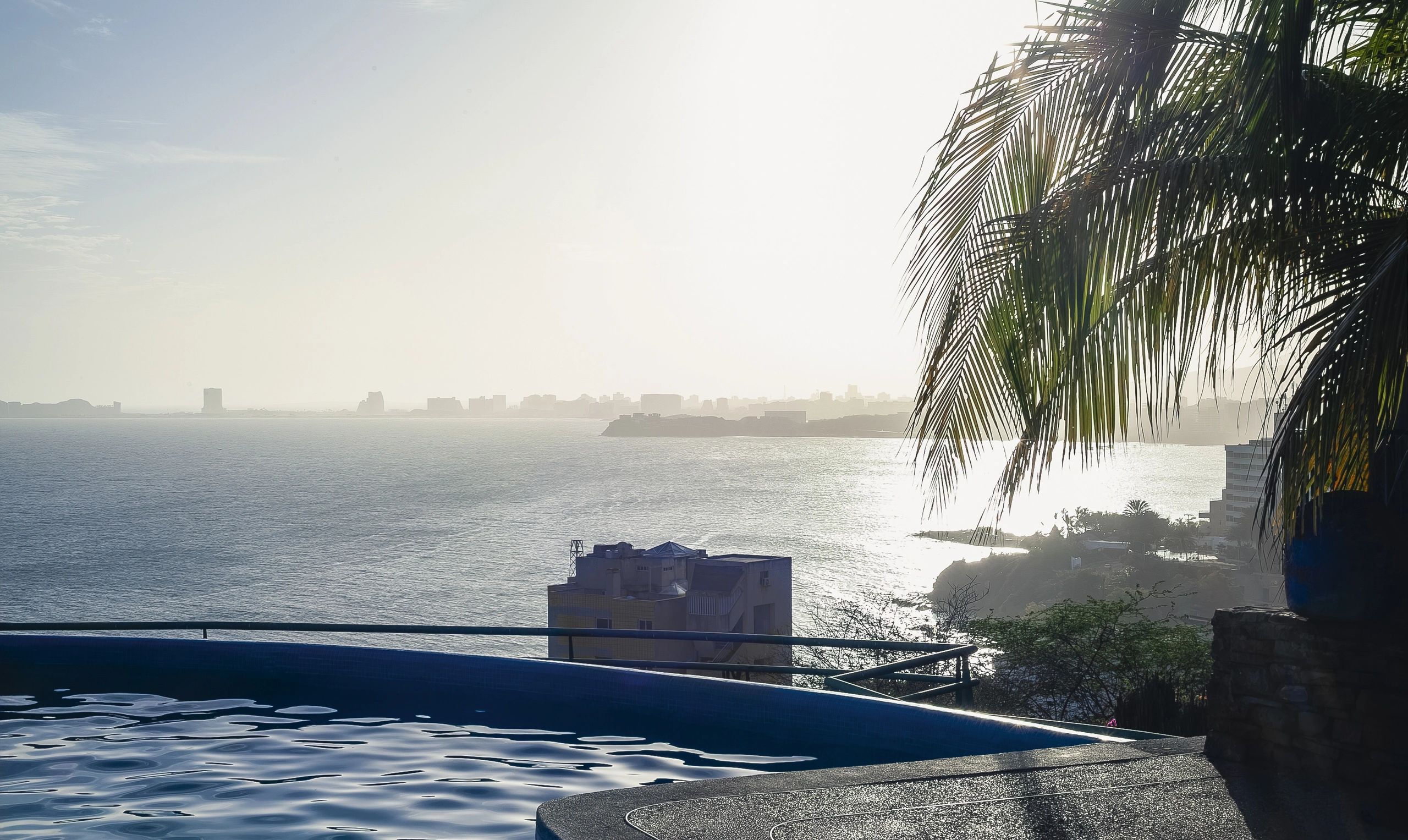 Private villa infinity pool at sunset