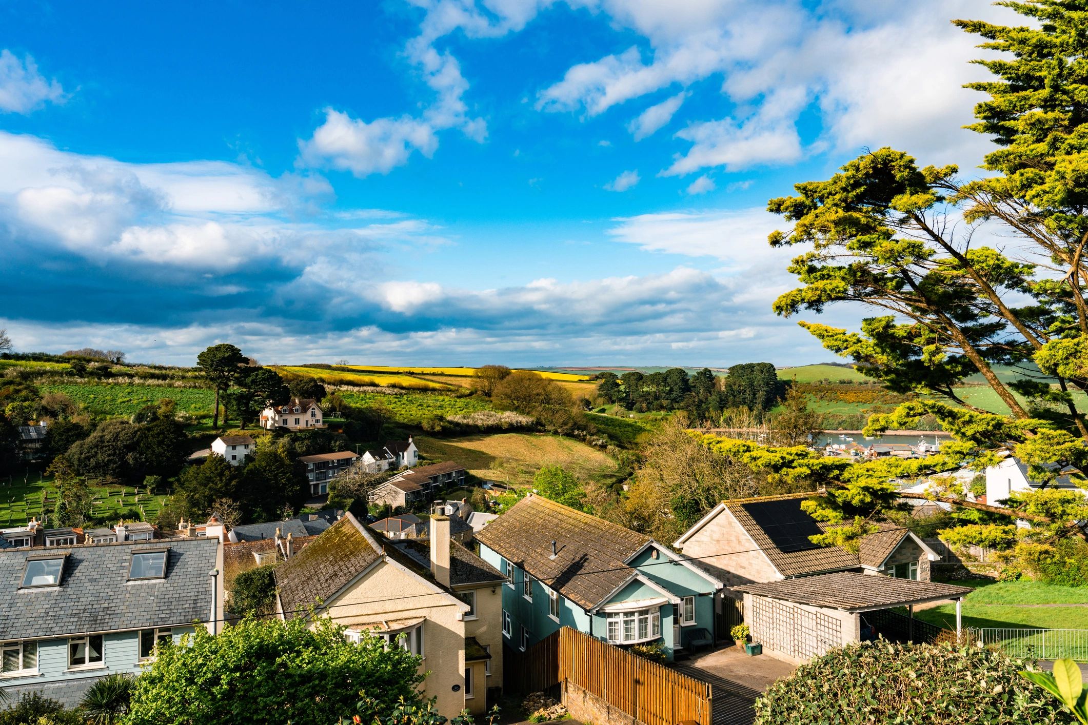 Salcombe village houses nestled in rolling green landscape